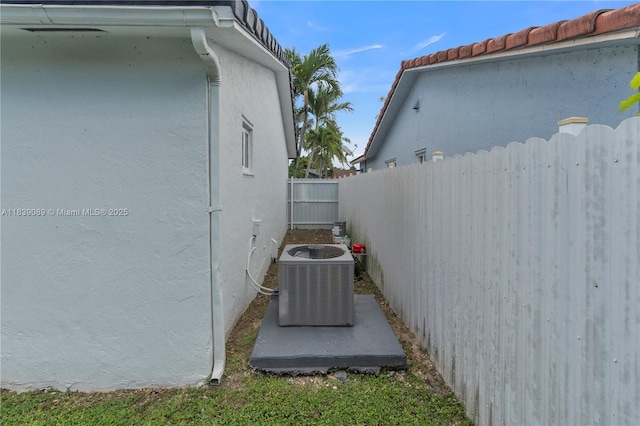 18030 SW 153rd Ct, Miami, FL 33187 - view of side of home with stucco siding and a fenced backyard