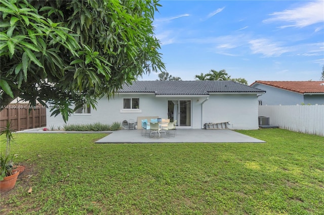 18030 SW 153rd Ct, Miami, FL 33187 - back of house with stucco siding, a fenced backyard, a tile roof, and a patio