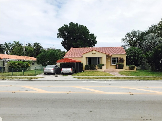 1739 SW 12th Ave, Miami, FL 33129 - mediterranean / spanish home with a tile roof, stucco siding, and driveway