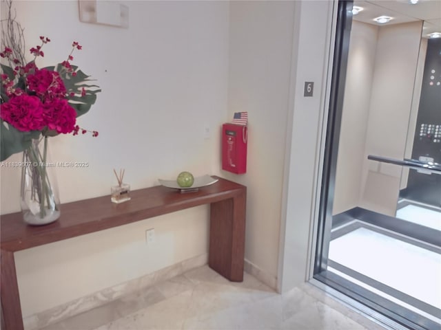 445 Grand Bay Dr Unit 601, Key Biscayne, FL 33149 - elevator with baseboards and a fire extinguisher