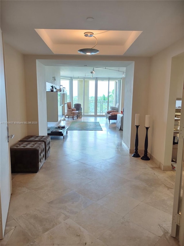 445 Grand Bay Dr Unit 601, Key Biscayne, FL 33149 - hallway with a tray ceiling and baseboards