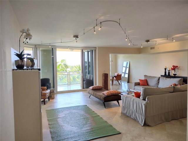 445 Grand Bay Dr Unit 601, Key Biscayne, FL 33149 - living area with healthy amount of natural light, rail lighting, and expansive windows