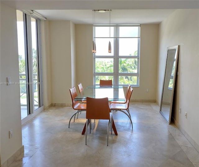 445 Grand Bay Dr Unit 601, Key Biscayne, FL 33149 - dining area featuring concrete floors and baseboards