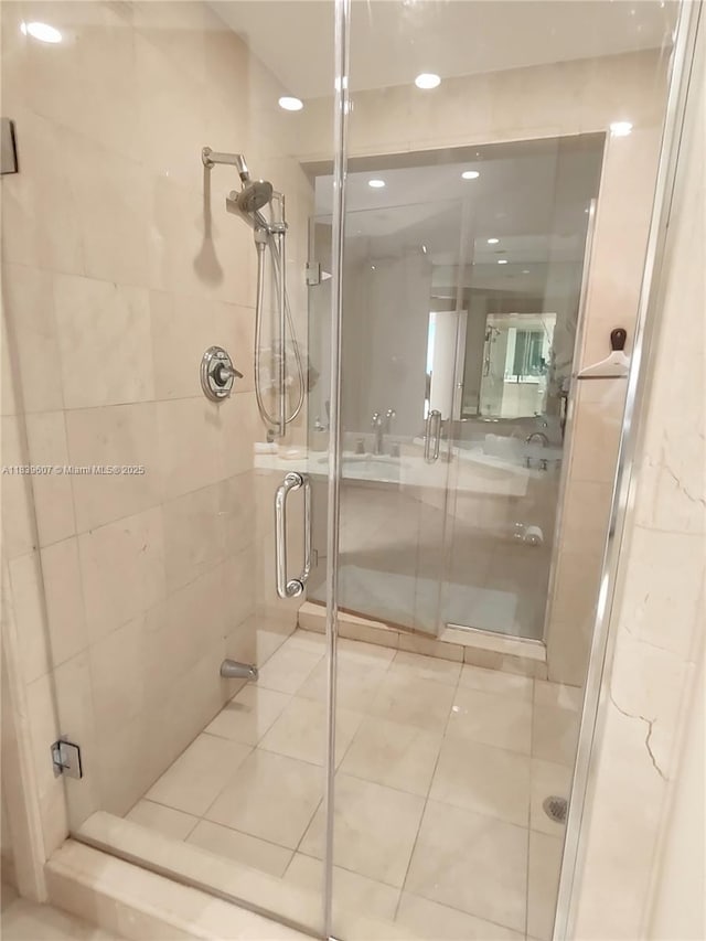 445 Grand Bay Dr Unit 601, Key Biscayne, FL 33149 - bathroom with a shower stall, tile patterned floors, and recessed lighting