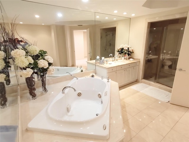 445 Grand Bay Dr Unit 601, Key Biscayne, FL 33149 - bathroom with a tub with jets, vanity, a stall shower, tile patterned flooring, and recessed lighting