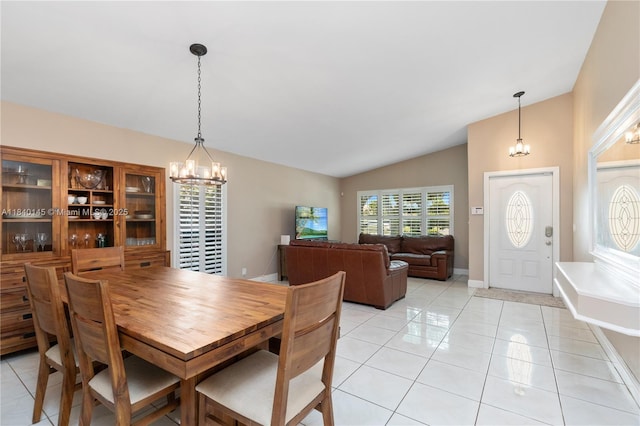 1710 SW 100th Ter, Davie, FL 33324 - dining room featuring a chandelier, vaulted ceiling, and light tile patterned floors