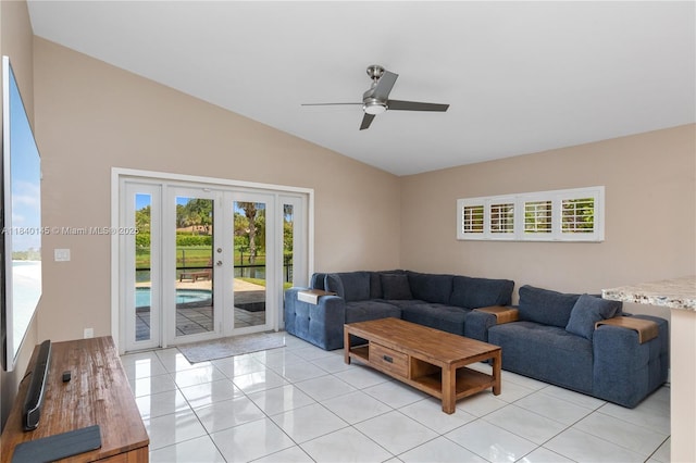 1710 SW 100th Ter, Davie, FL 33324 - living room featuring vaulted ceiling, plenty of natural light, light tile patterned flooring, and a ceiling fan