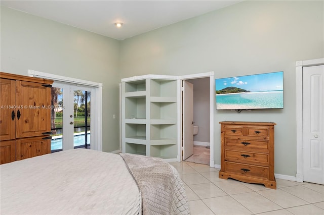 1710 SW 100th Ter, Davie, FL 33324 - bedroom with french doors, light tile patterned flooring, and access to outside