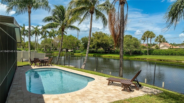 1710 SW 100th Ter, Davie, FL 33324 - view of swimming pool with a patio area, a water view, a fenced backyard, and outdoor dining area