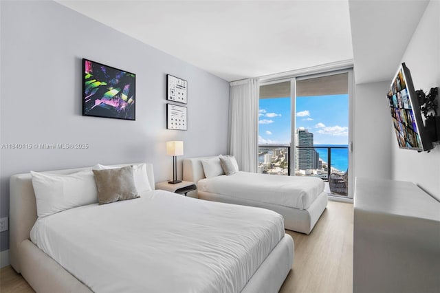 4111 S Ocean Dr Unit 2906, Hollywood, FL 33019 - bedroom with access to outside, light wood finished floors, and a wall of windows