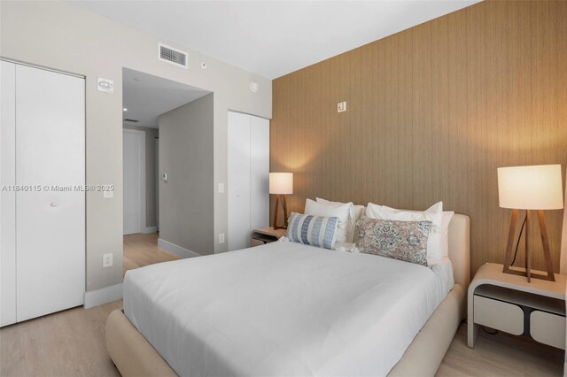 4111 S Ocean Dr Unit 2906, Hollywood, FL 33019 - bedroom featuring light wood-style flooring and multiple closets