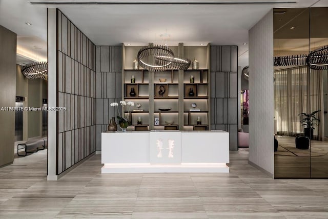 4111 S Ocean Dr Unit 2906, Hollywood, FL 33019 - bar area with a chandelier, light tile patterned flooring, and a high ceiling