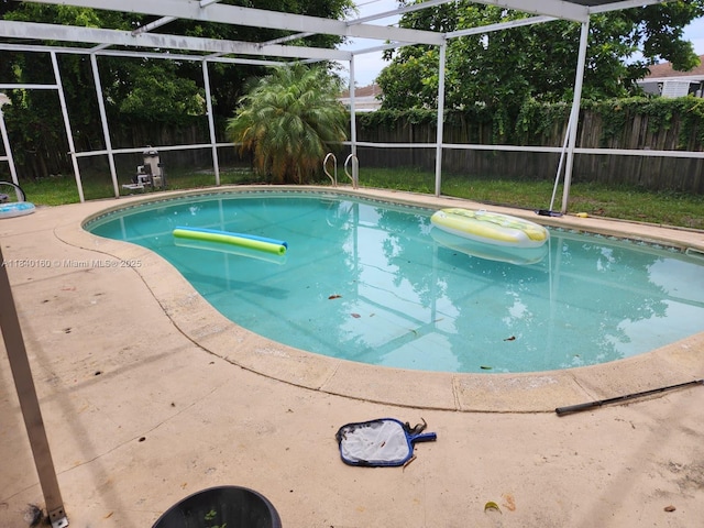 850 NE 172nd Ter, North Miami Beach, FL 33162 - view of pool featuring a fenced backyard, a lanai, and a patio