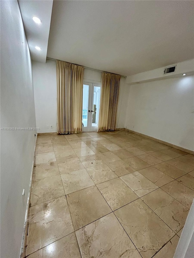 5401 Collins Ave Unit 514, Miami Beach, FL 33140 - spare room with french doors, recessed lighting, and light tile patterned floors