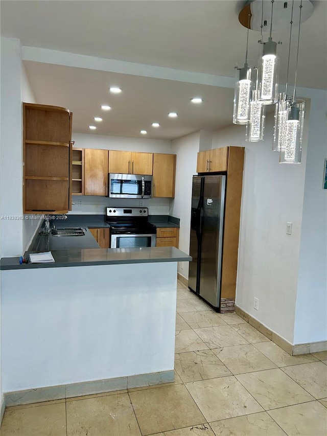 5401 Collins Ave Unit 514, Miami Beach, FL 33140 - kitchen with stainless steel appliances, brown cabinetry, a peninsula, dark countertops, and recessed lighting
