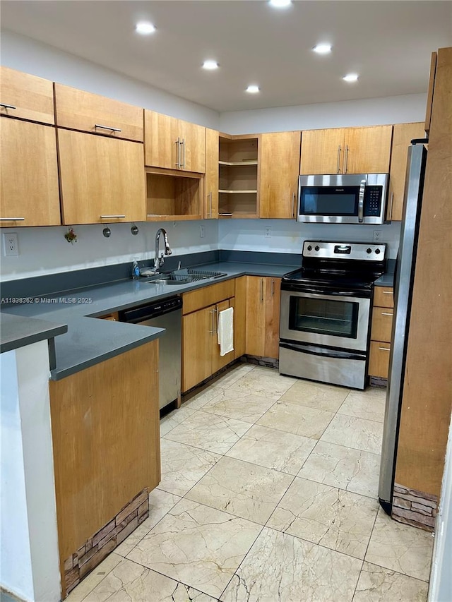 5401 Collins Ave Unit 514, Miami Beach, FL 33140 - kitchen with stainless steel appliances, dark countertops, open shelves, light marble finish floors, and recessed lighting