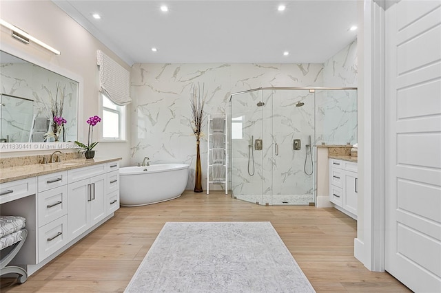 11971 Torreyanna, West Palm Beach, FL 33412 - full bath with vanity, a marble finish shower, a freestanding tub, recessed lighting, and wood finished floors