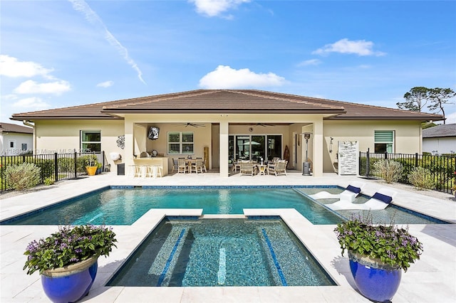 11971 Torreyanna, West Palm Beach, FL 33412 - rear view of property featuring ceiling fan, a pool with connected hot tub, stucco siding, and a patio