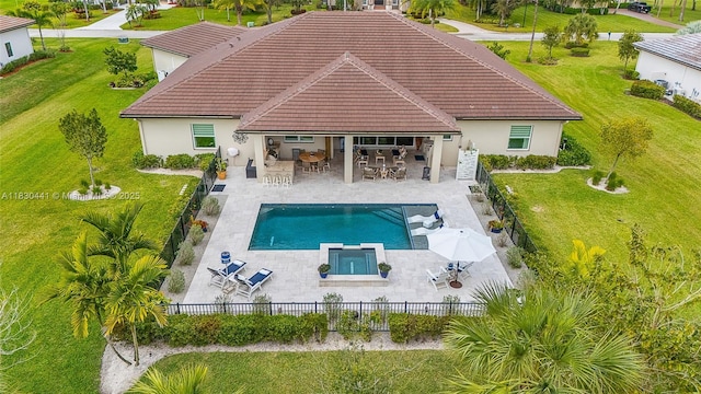 11971 Torreyanna, West Palm Beach, FL 33412 - back of property with outdoor dining space, an in-ground hot tub, stucco siding, a fenced backyard, and a tiled roof