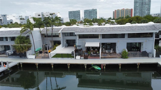324 Poinciana Dr Unit 906, Sunny Isles Beach, FL 33160 - rear view of house featuring a water view
