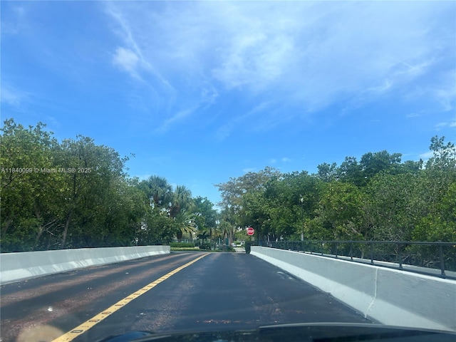 324 Poinciana Dr Unit 906, Sunny Isles Beach, FL 33160 - view of asphalt street with traffic signs