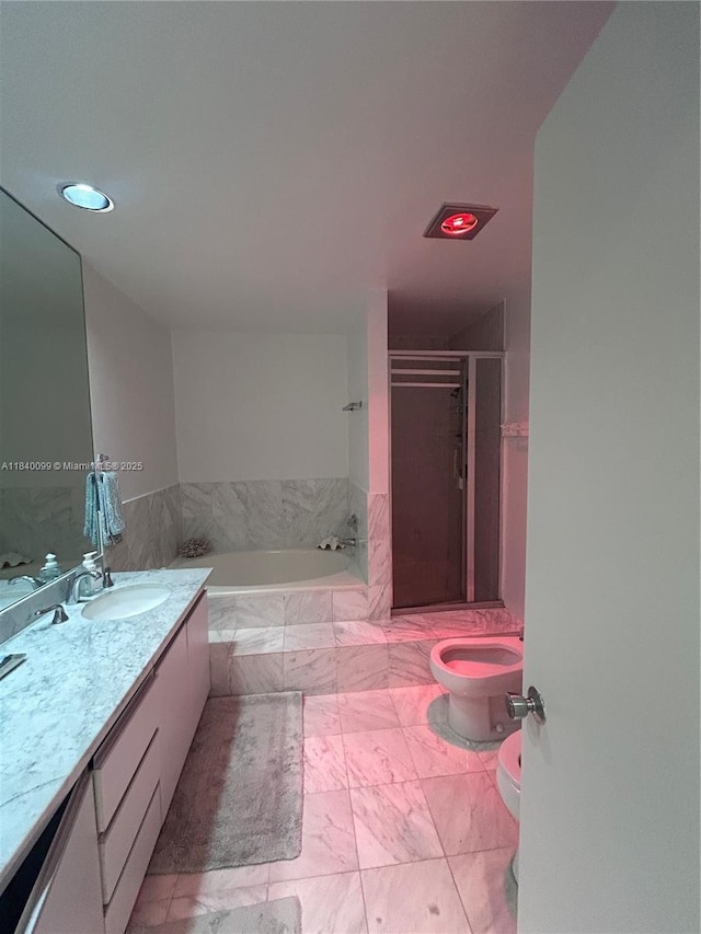 324 Poinciana Dr Unit 906, Sunny Isles Beach, FL 33160 - bathroom with vanity, a garden tub, a shower stall, marble finish floors, and recessed lighting