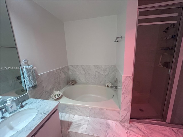324 Poinciana Dr Unit 906, Sunny Isles Beach, FL 33160 - bathroom with vanity, a garden tub, and a shower stall