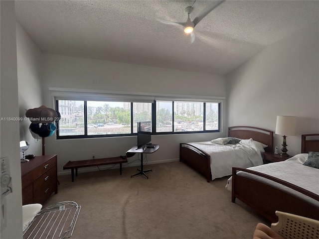 324 Poinciana Dr Unit 906, Sunny Isles Beach, FL 33160 - bedroom featuring a textured ceiling, light colored carpet, and a ceiling fan
