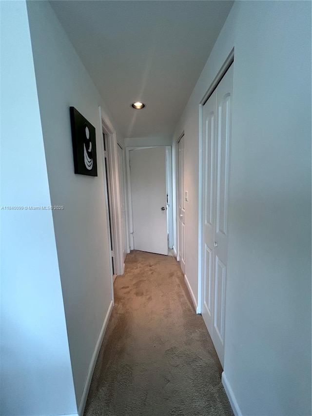 324 Poinciana Dr Unit 906, Sunny Isles Beach, FL 33160 - hallway featuring light carpet and recessed lighting