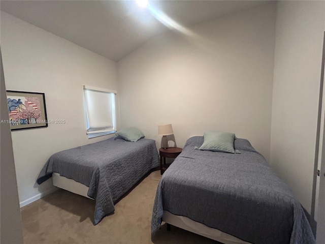 324 Poinciana Dr Unit 906, Sunny Isles Beach, FL 33160 - carpeted bedroom featuring vaulted ceiling and baseboards