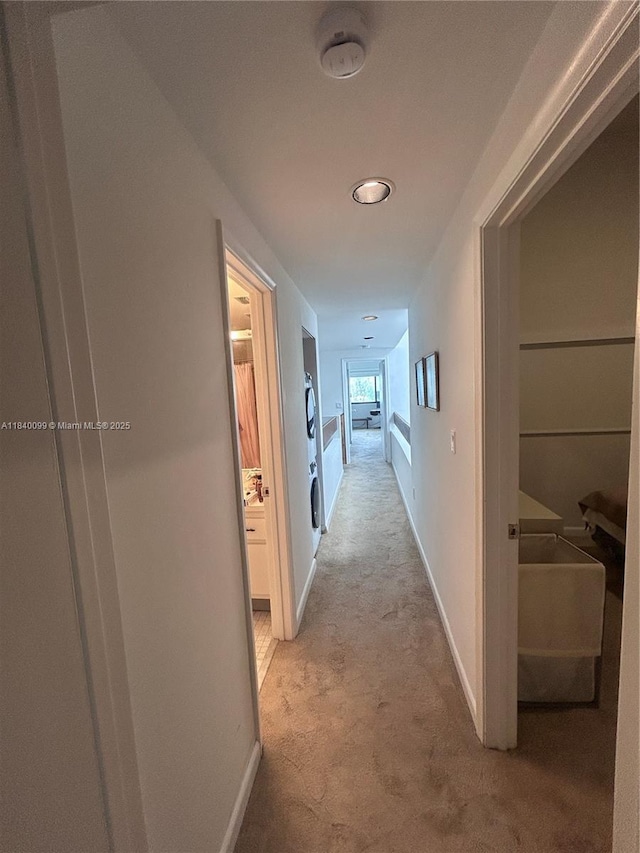 324 Poinciana Dr Unit 906, Sunny Isles Beach, FL 33160 - hall with light colored carpet and baseboards