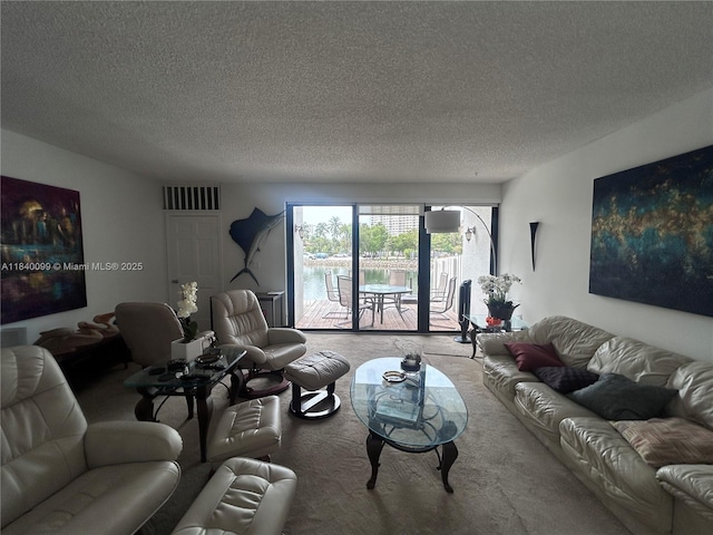 324 Poinciana Dr Unit 906, Sunny Isles Beach, FL 33160 - living room with a textured ceiling