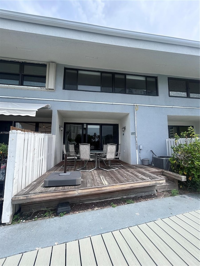 324 Poinciana Dr Unit 906, Sunny Isles Beach, FL 33160 - wooden terrace featuring outdoor dining space
