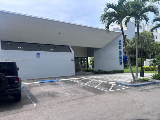 324 Poinciana Dr Unit 906, Sunny Isles Beach, FL 33160 - view of property with uncovered parking
