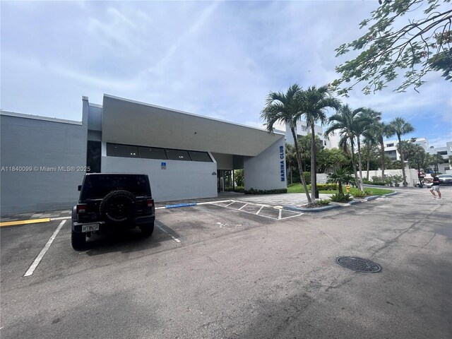 324 Poinciana Dr Unit 906, Sunny Isles Beach, FL 33160 - view of uncovered parking lot