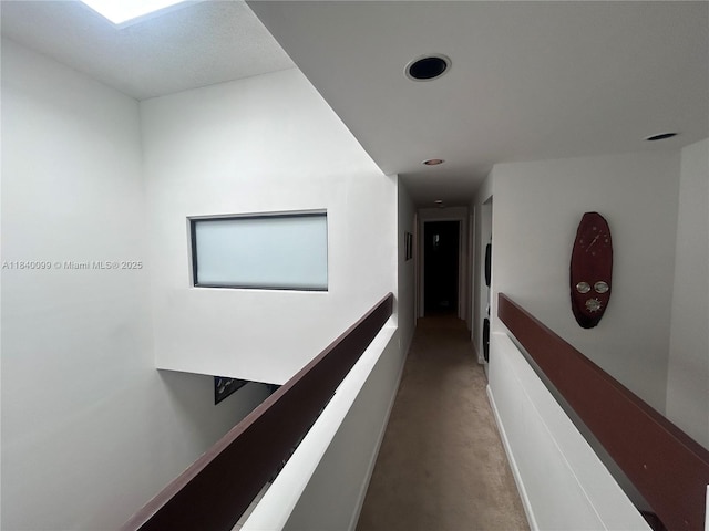 324 Poinciana Dr Unit 906, Sunny Isles Beach, FL 33160 - hallway featuring carpet floors, recessed lighting, and an upstairs landing