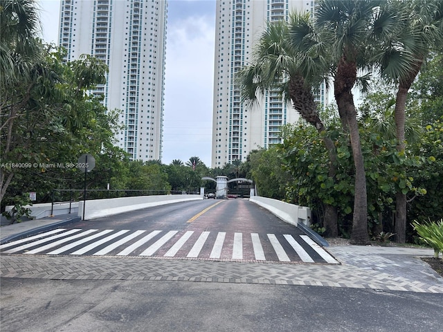 324 Poinciana Dr Unit 906, Sunny Isles Beach, FL 33160 - view of asphalt road with traffic signs and a city view