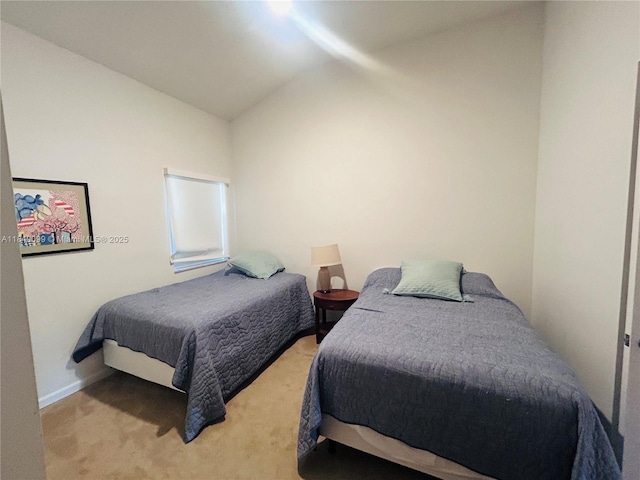 324 Poinciana Dr Unit 906, Sunny Isles Beach, FL 33160 - carpeted bedroom with lofted ceiling and baseboards
