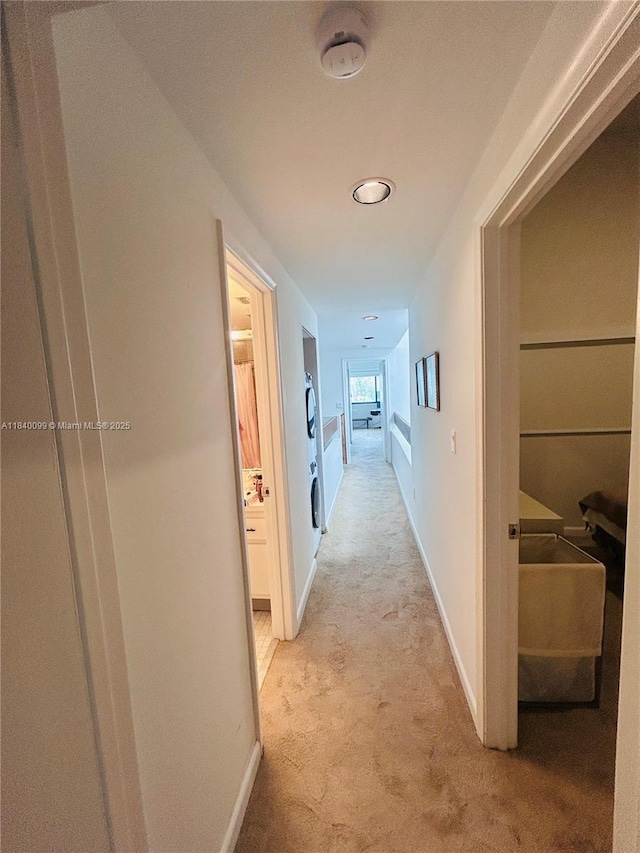 324 Poinciana Dr Unit 906, Sunny Isles Beach, FL 33160 - hallway with light colored carpet and baseboards