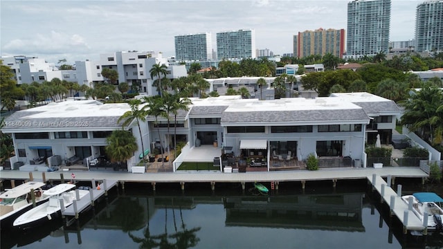 324 Poinciana Dr Unit 906, Sunny Isles Beach, FL 33160 - rear view of house featuring a water view and a city view