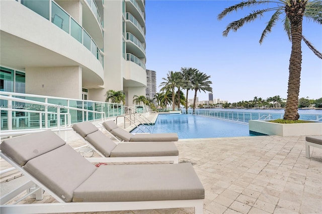 20201 E Country Club Dr Unit 1202, Aventura, FL 33180 - community pool featuring an outdoor hangout area and a patio area