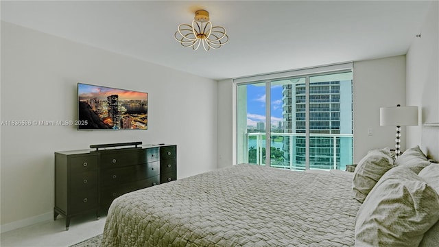 20201 E Country Club Dr Unit 1202, Aventura, FL 33180 - bedroom featuring expansive windows and a chandelier