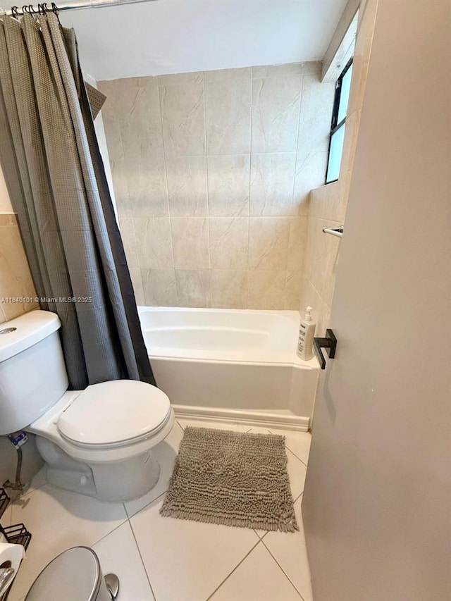 6169 NW 170th Ter, Hialeah, FL 33015 - bathroom featuring tile patterned flooring and shower / bath combination with curtain