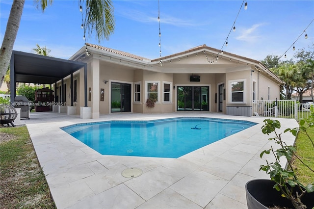 932 NW 123rd Dr, Coral Springs, FL 33071 - back of property with a patio, an outdoor pool, and stucco siding