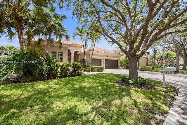 932 NW 123rd Dr, Coral Springs, FL 33071 - mediterranean / spanish house with concrete driveway, an attached garage, a front yard, stucco siding, and a tile roof