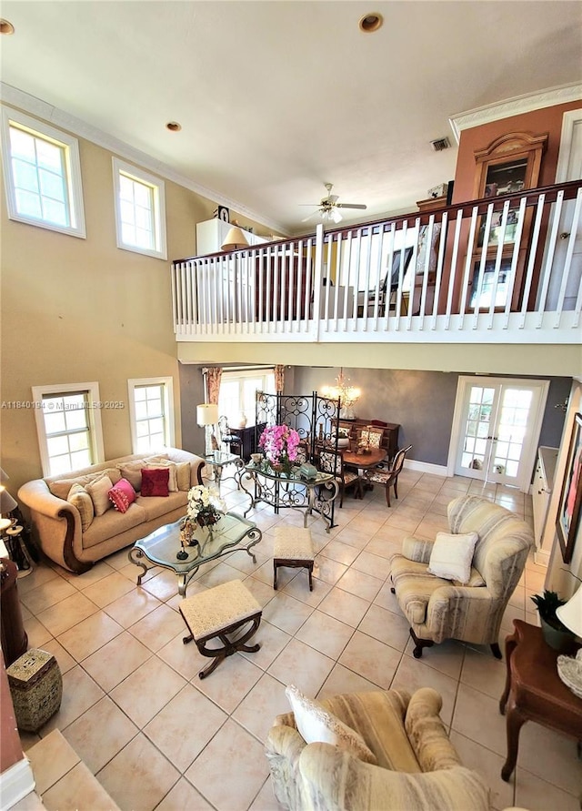 9057 SW 157th Path, Miami, FL 33196 - living area with ornamental molding, a high ceiling, tile patterned flooring, healthy amount of natural light, and a ceiling fan