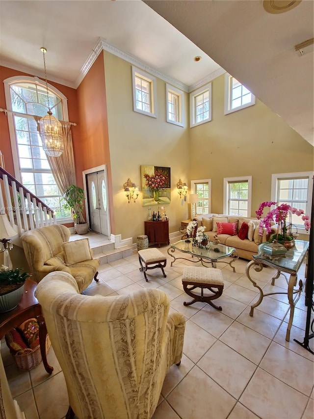 9057 SW 157th Path, Miami, FL 33196 - living room featuring a chandelier, ornamental molding, a high ceiling, and light tile patterned floors
