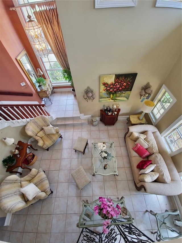 9057 SW 157th Path, Miami, FL 33196 - tiled living room featuring a high ceiling and a chandelier