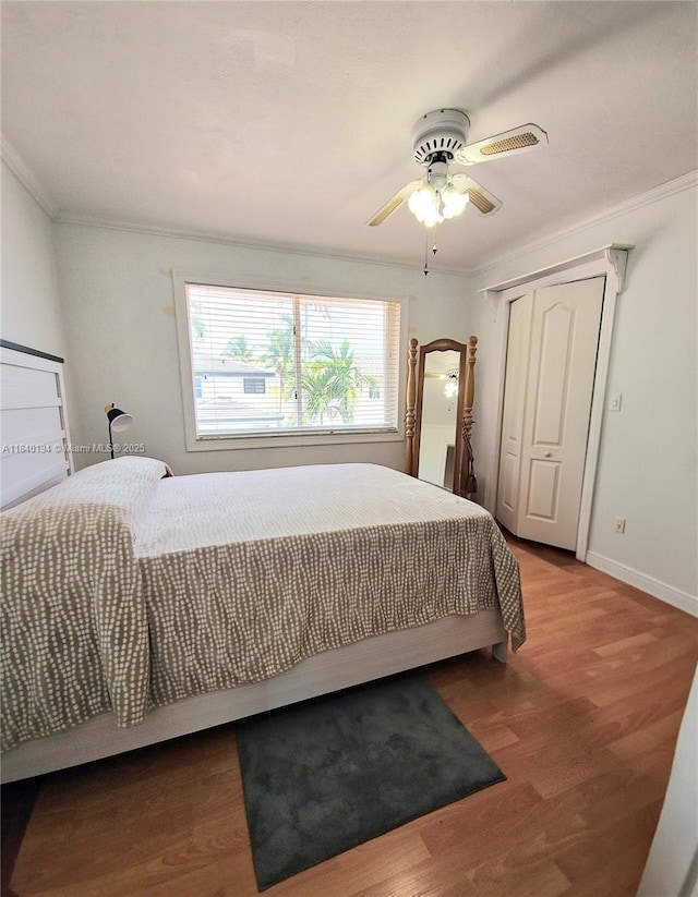 9057 SW 157th Path, Miami, FL 33196 - bedroom with ornamental molding, wood finished floors, a closet, and a ceiling fan