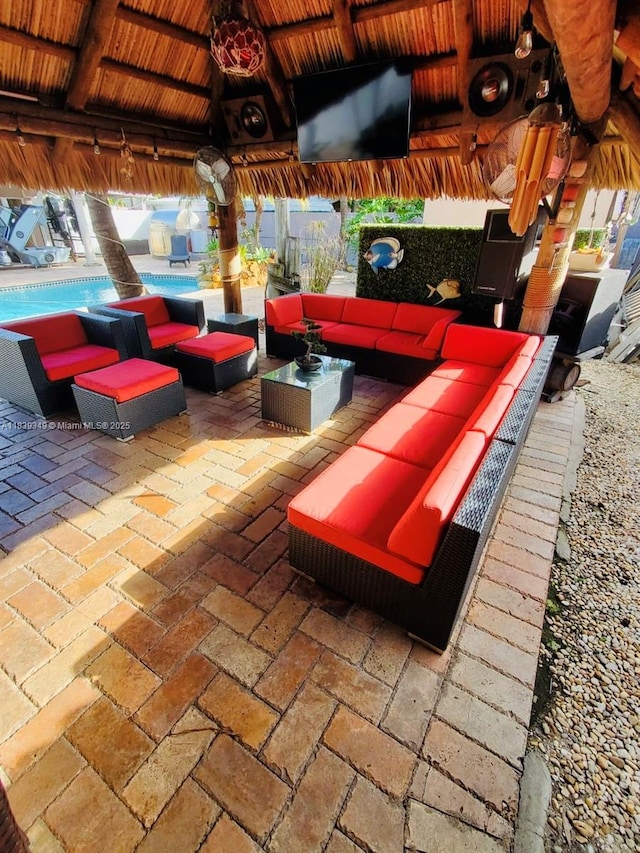 180 E 46th St, Hialeah, FL 33013 - view of patio / terrace featuring a gazebo, an outdoor living space, and an outdoor pool
